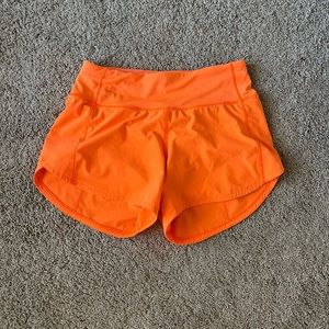 lululemon speed up shorts (neon orange)